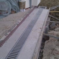 Trench drain installation in a concrete base